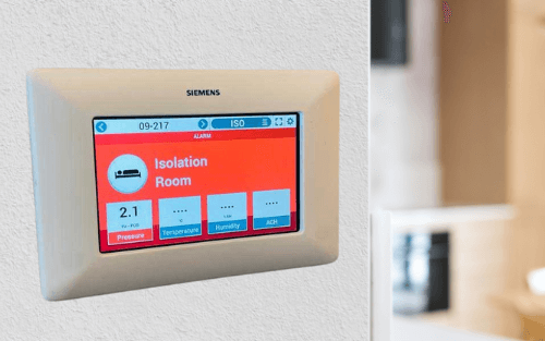 Digital BMS thermostat displaying temperature and settings. Part of Gitco's building management system solutions.
