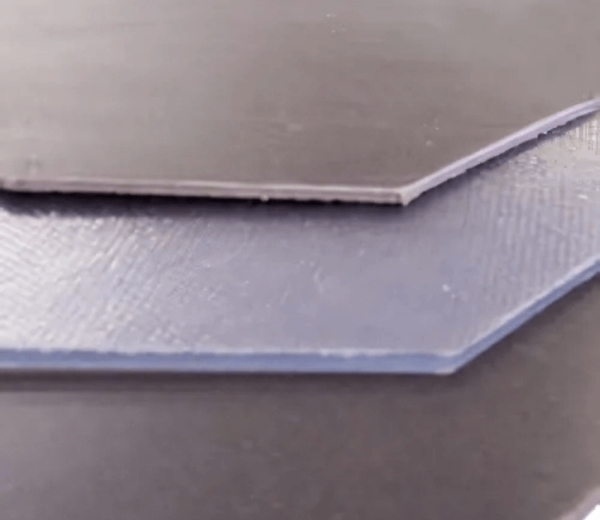 Gitco mass loaded vinyl barrier used in industrial noise control setup for machinery and HVAC systems.