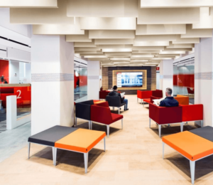 Colorful PET acoustic ceiling baffles enhance sound absorption and design in a creative workspace.