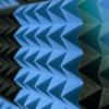 Close-up view of Gitco Pyramid Acoustic Foam Panels showing textured pyramid design for superior sound absorption.